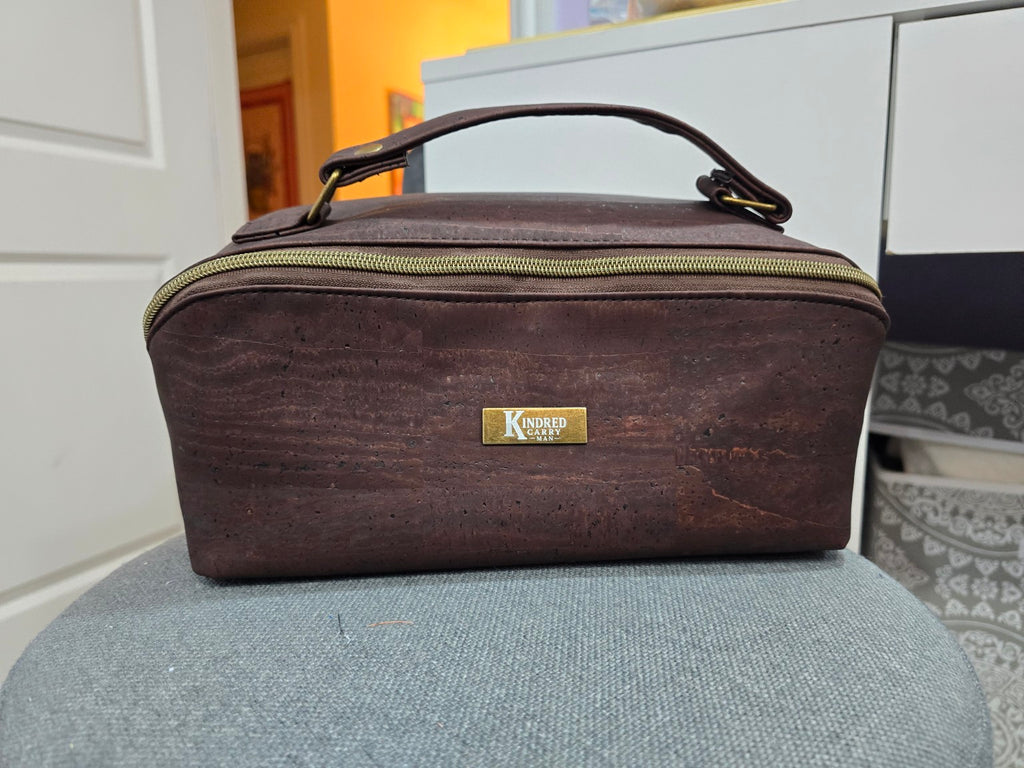 Charles Dopp Kit in dark brown cork with antique brass hardware, front view