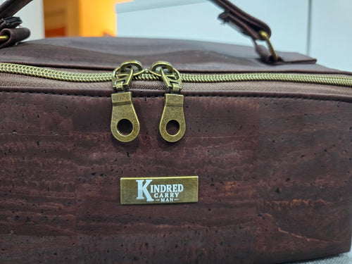 Dark brown cork Charles Dopp Kit with antique brass zipper and KC Man label detail