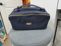 Charles Dopp Kit in navy cork with antique brass hardware, front view