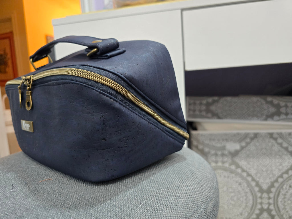 Navy cork Charles Dopp Kit angled side view showing wide-opening zipper and carry handle