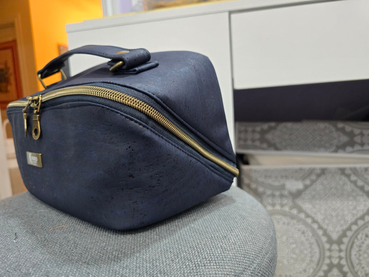 Navy cork Charles Dopp Kit angled side view showing wide-opening zipper and carry handle