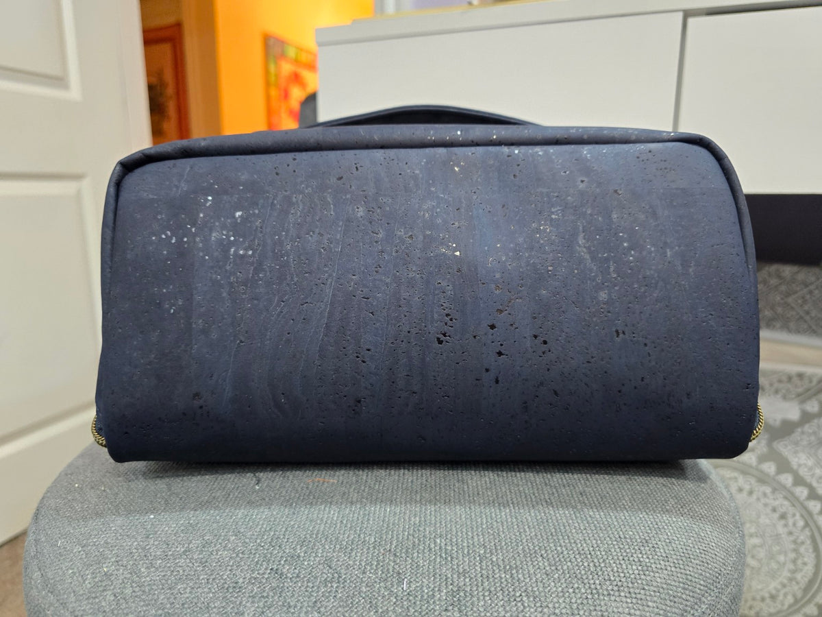 Navy cork Charles Dopp Kit bottom panel showing natural cork texture