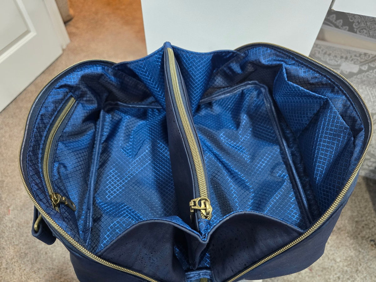 Charles Dopp Kit interior with blue ripstop lining, center zip divider, zip pocket and slip pockets