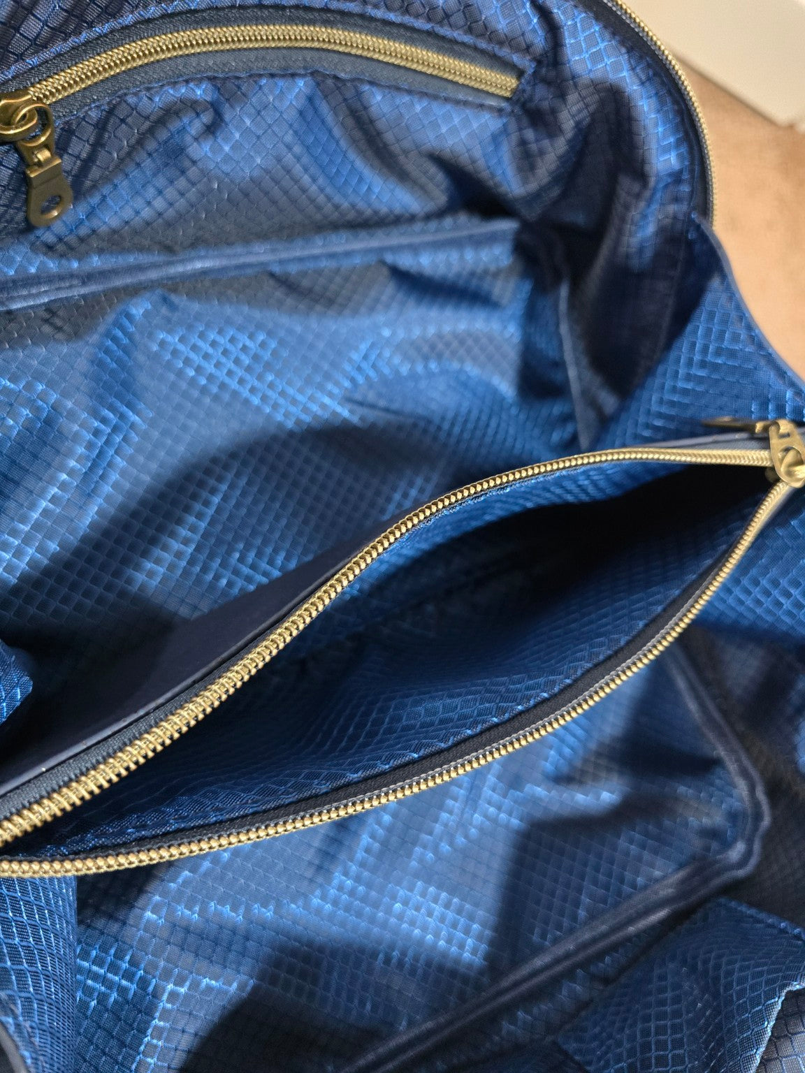 Charles Dopp Kit interior showing zippered center divider and blue ripstop lining