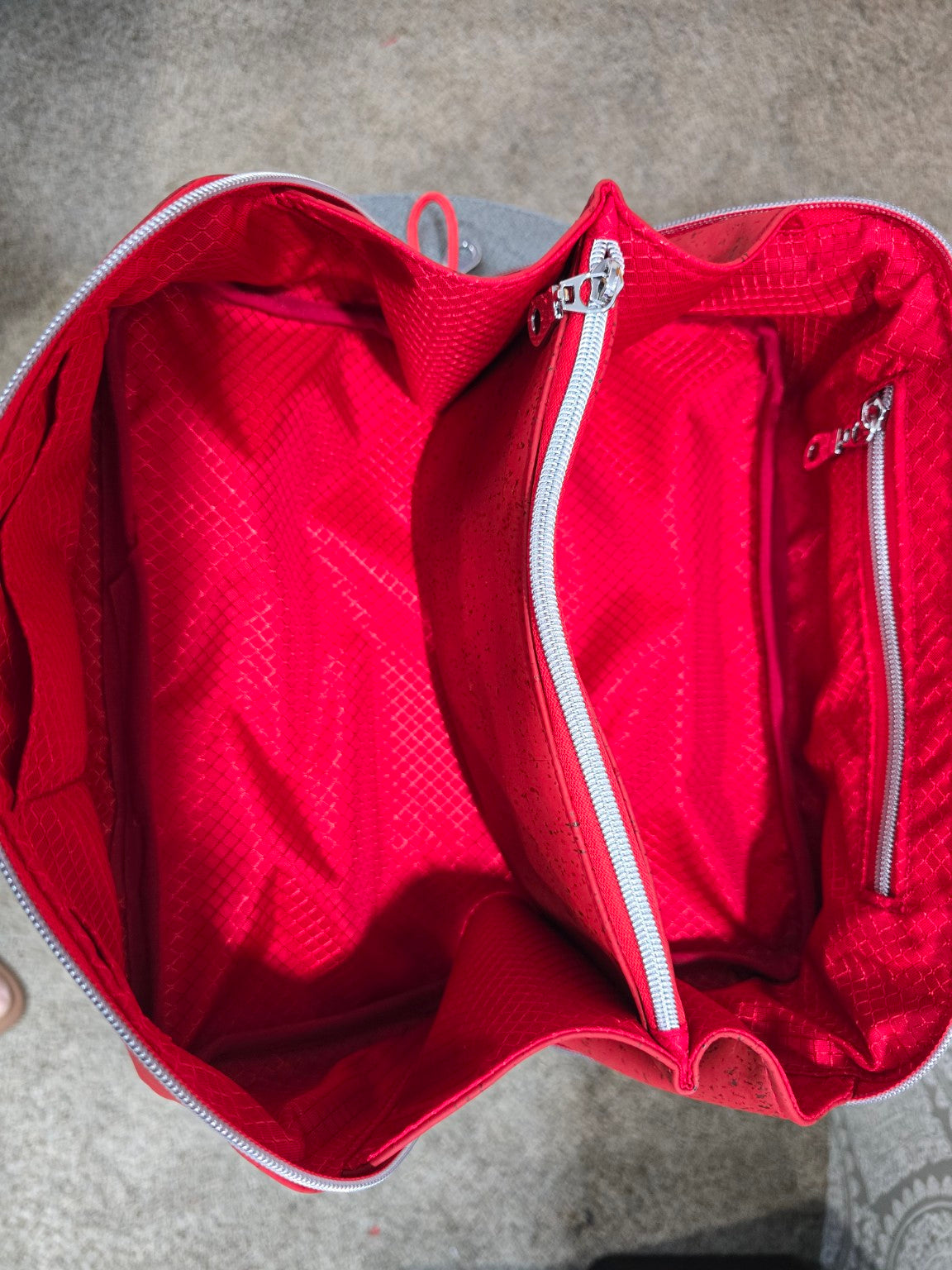 Red Charles Dopp Kit open showing coordinating red ripstop lining and center zip divider