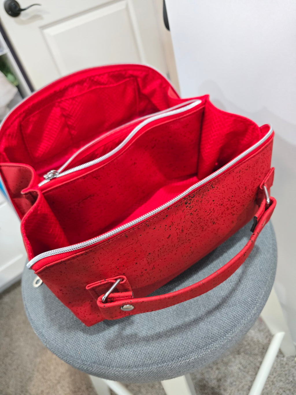 Red Charles Dopp Kit wide open showing center divider and interior organization
