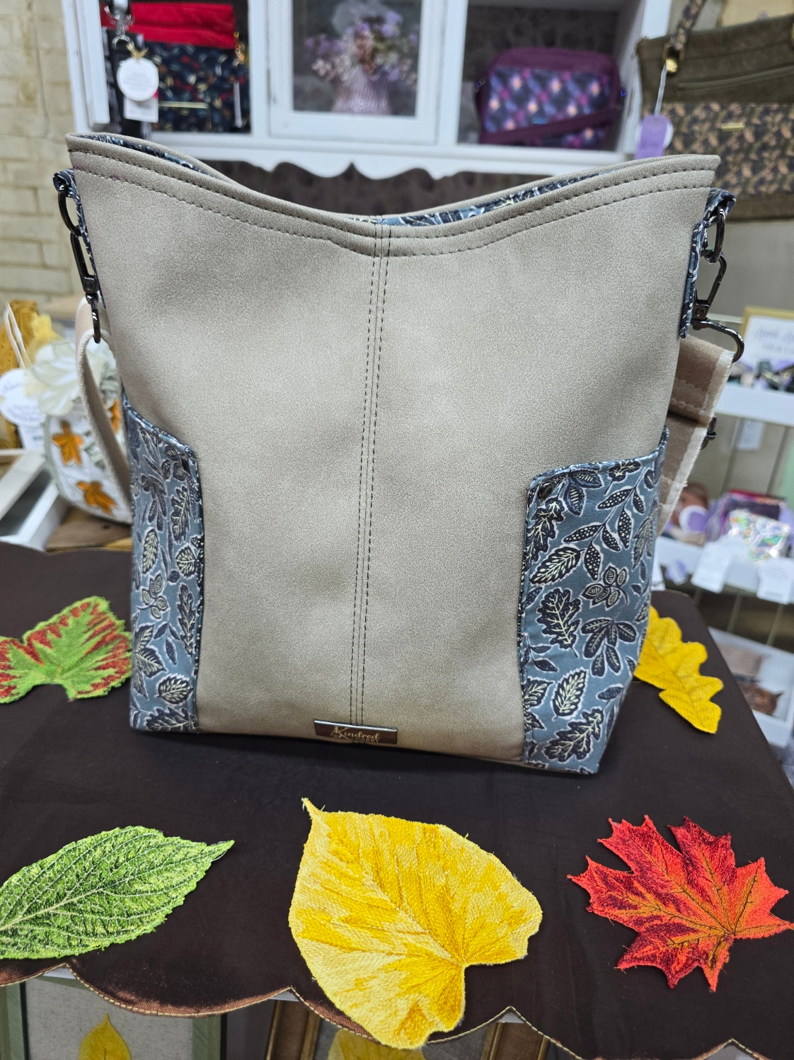 Kindred Carry Compass crossbody in fall beige Mora faux leather
