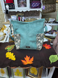 Kindred Carry Compass crossbody in fall green Mora faux suede