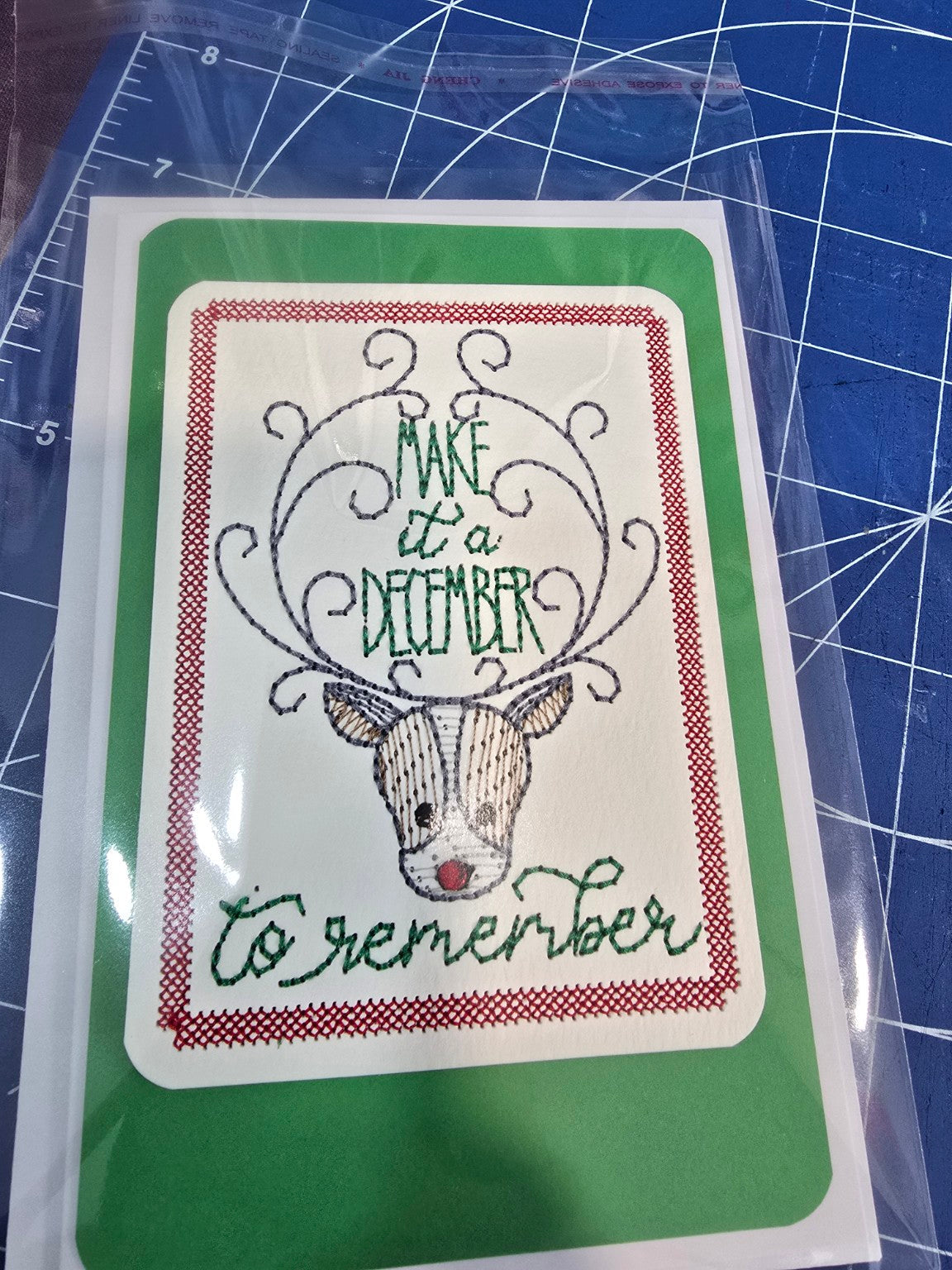 Kindred Carry embroidered reindeer Christmas greeting card reading Make It a December to Remember
