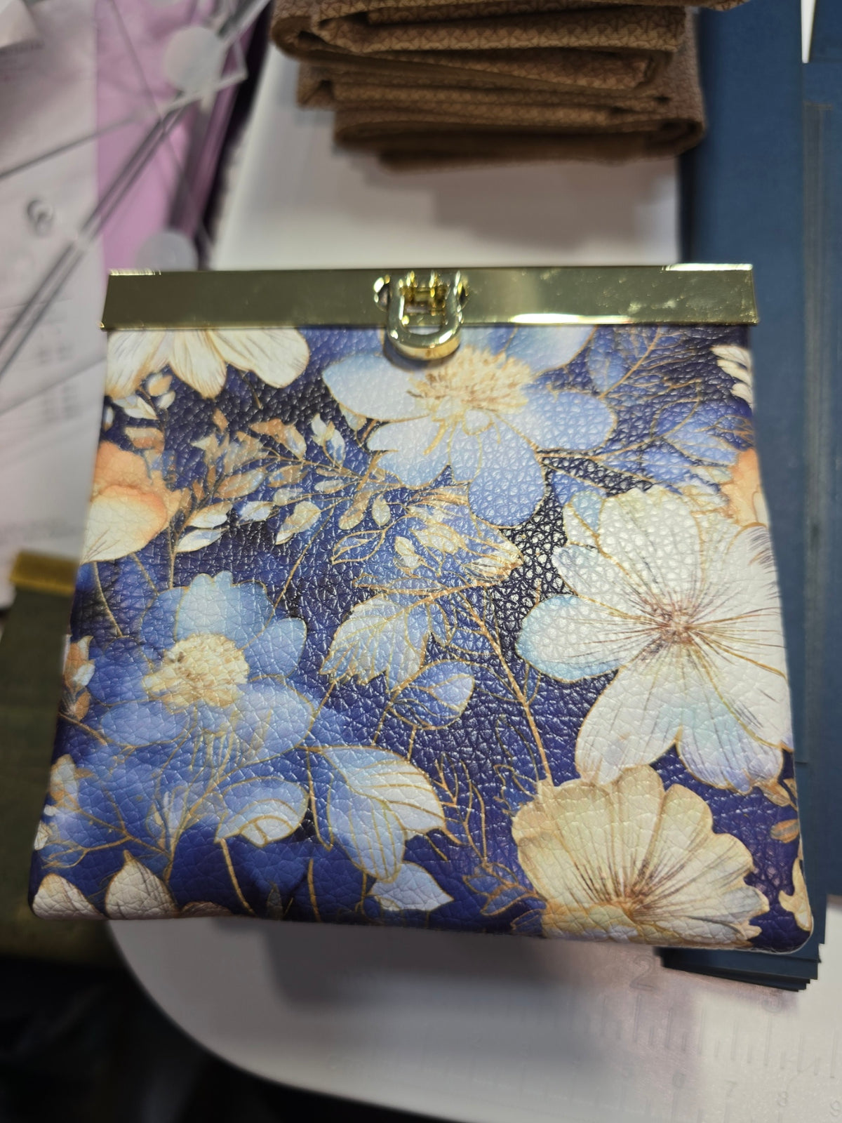 Mini Rozy wallet in blue floral vinyl with gold frame hardware