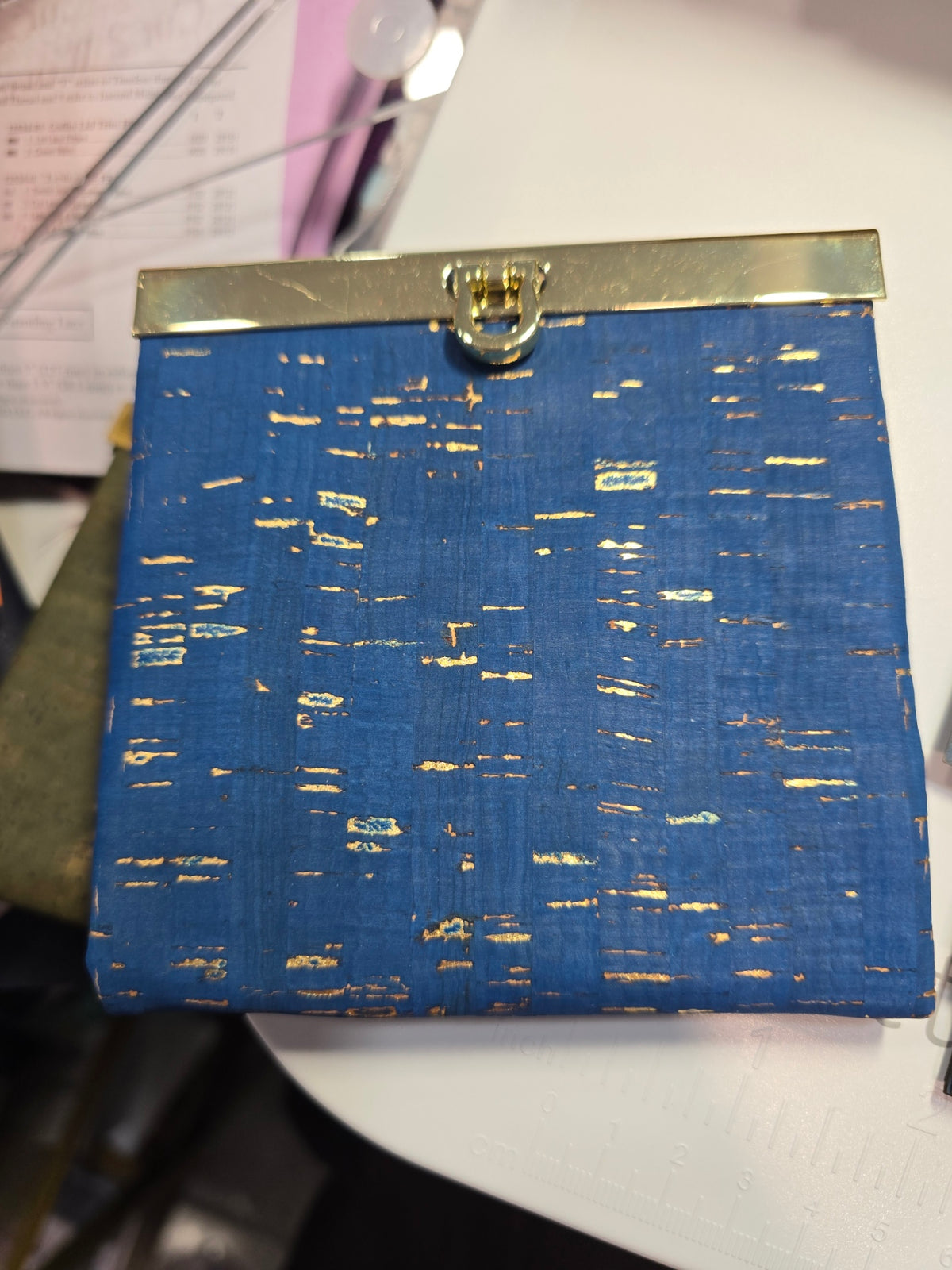 Mini Rozy wallet in blue cork with metallic gold accents and gold frame hardware