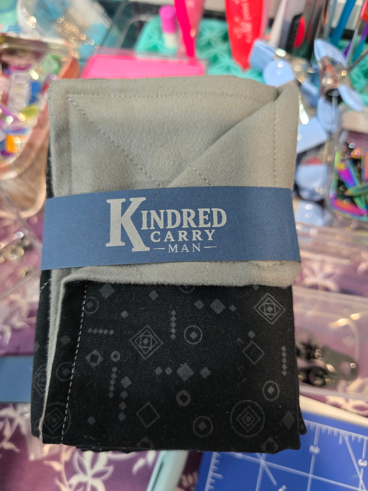 Kindred Carry Man Two-Faced Hank in black geometric cotton with gray microsuede