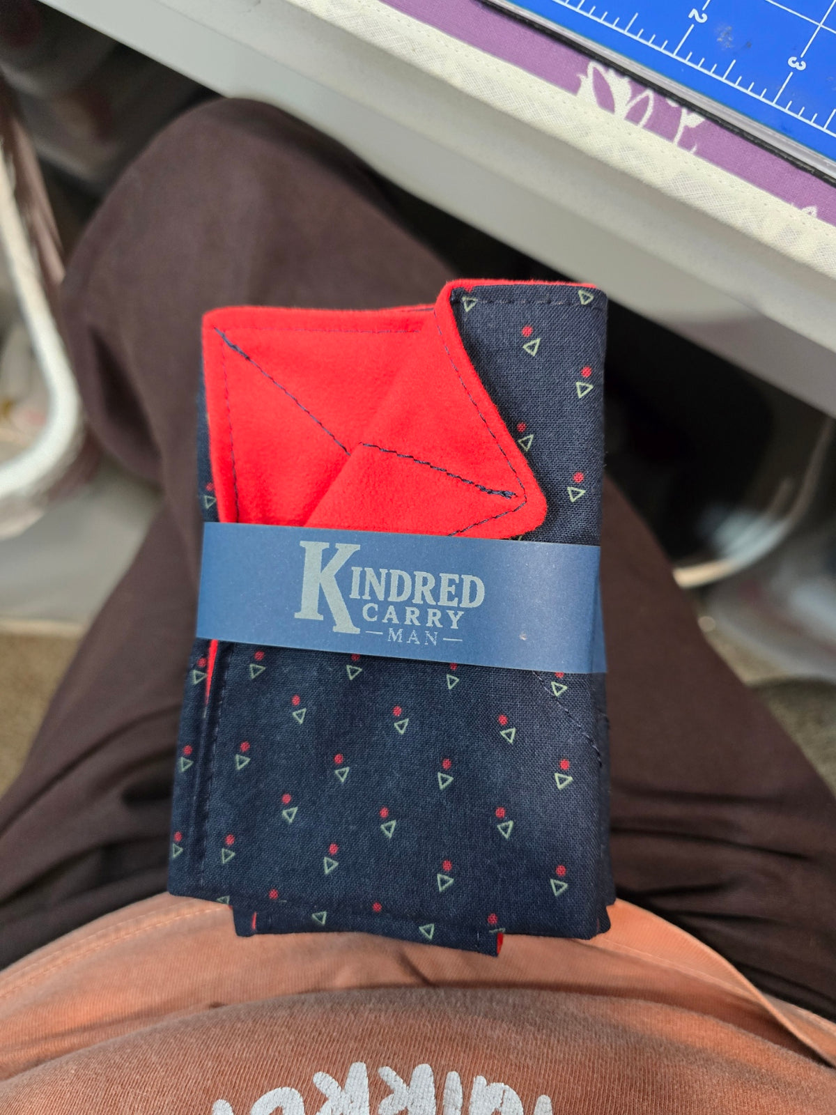 Kindred Carry Man Two-Faced Hank in navy and red geometric cotton with red microsuede